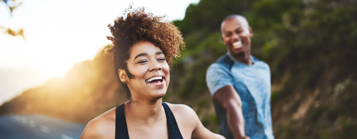 couple smiling on walk