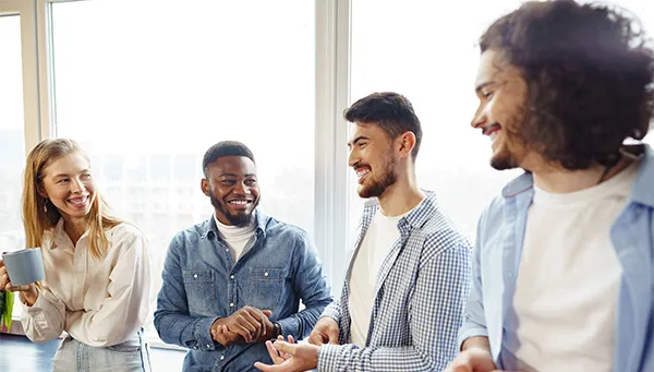 Group of providers smiling and conversing