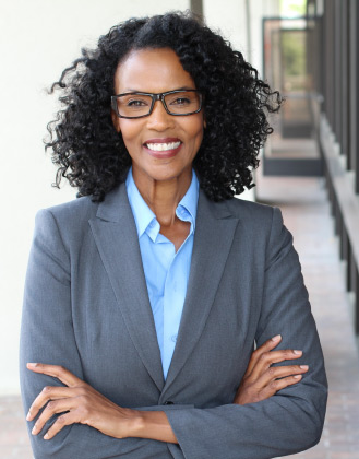 Female therapist in suit smiling